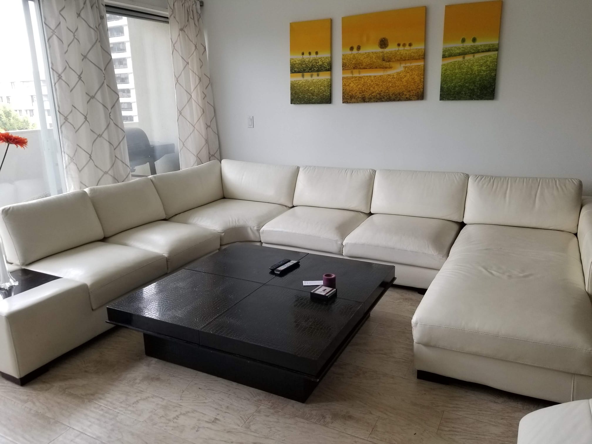 Custom Made Furniture - White sectional sofa with black coffee table