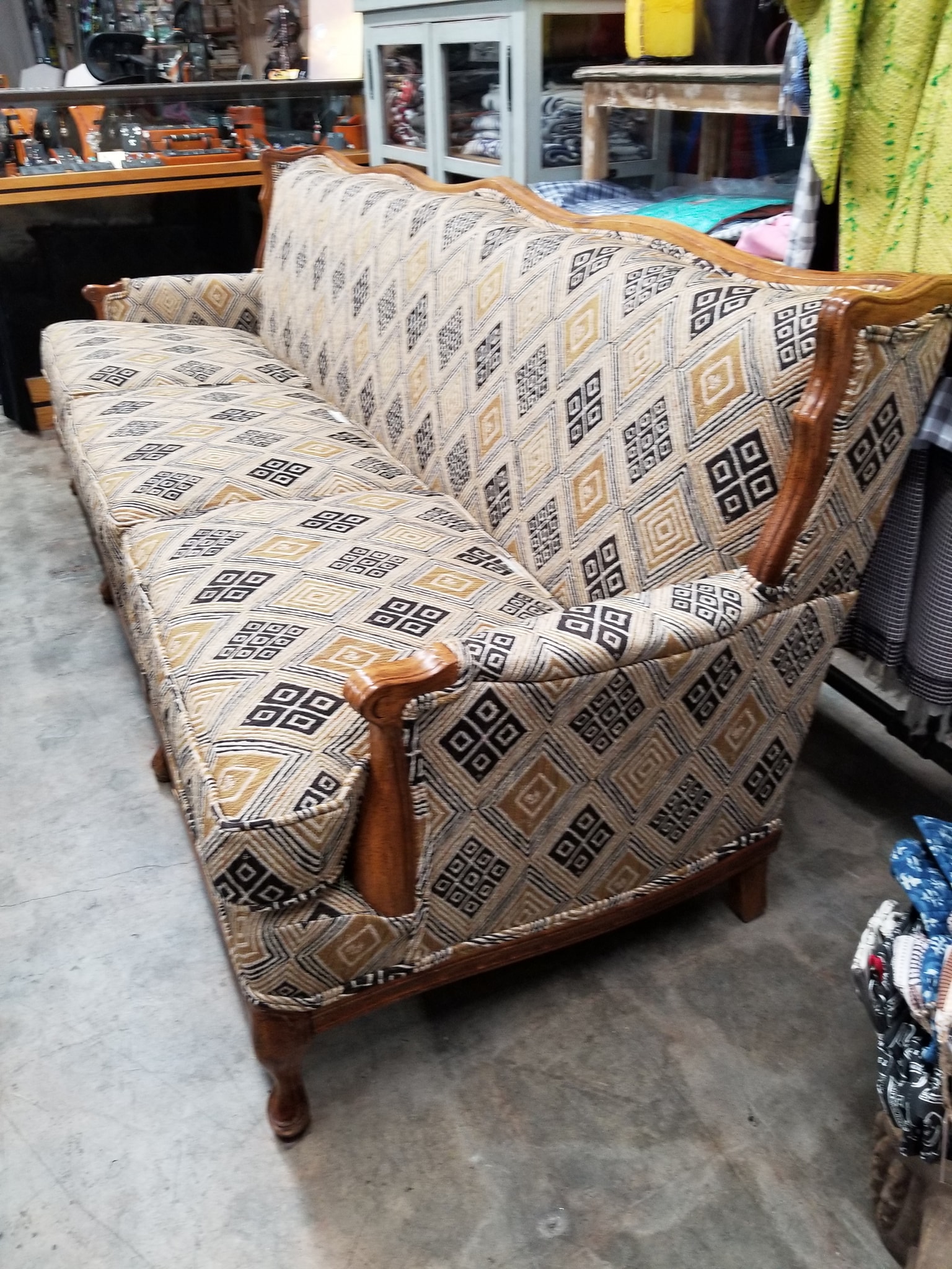 Two upholstered chairs with black and white patterned fabric