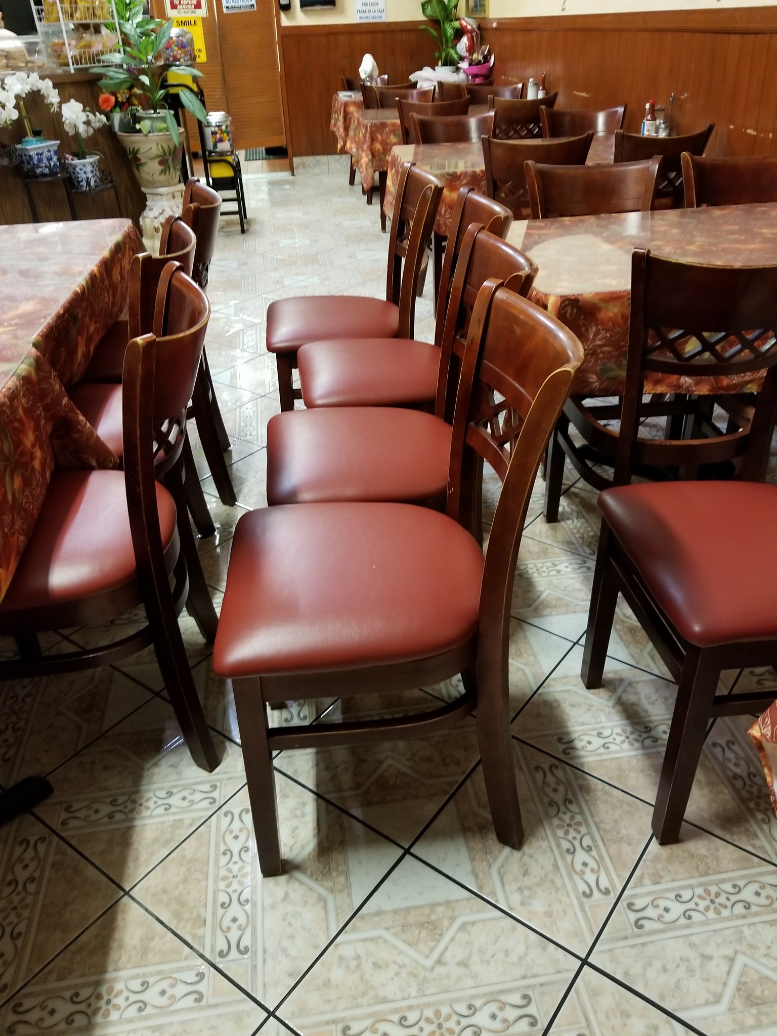 Leather Repair and Restoration - Restored reddish brown leather dining chairs with wooden frames